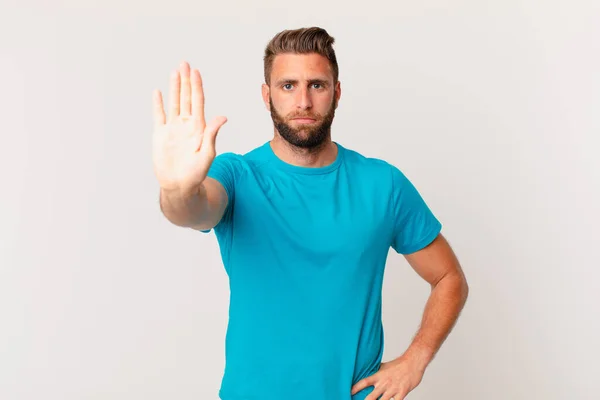 Young Handsome Man Looking Serious Showing Open Palm Making Stop — Φωτογραφία Αρχείου