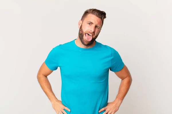 Young Handsome Man Cheerful Rebellious Attitude Joking Sticking Tongue Out — Stockfoto