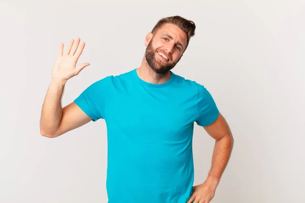 Young Handsome Man Smiling Happily Waving Hand Welcoming Greeting You — Foto Stock