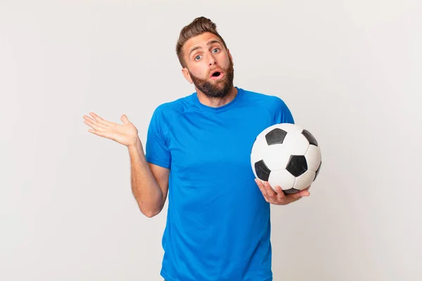 Young Handsome Man Looking Surprised Shocked Jaw Dropped Holding Object — Stock Photo, Image