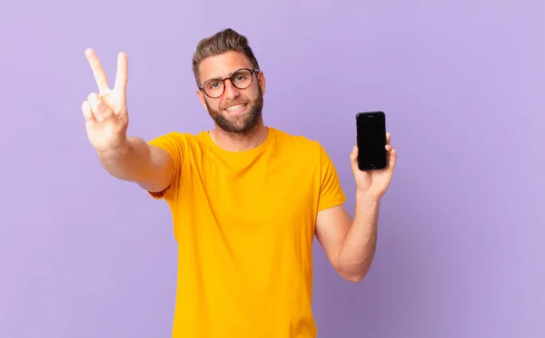 Young Handsome Man Smiling Looking Friendly Showing Number Two Cell — Stockfoto