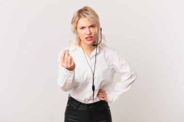 young pretty woman making capice or money gesture, telling you to pay. telemarketing concept