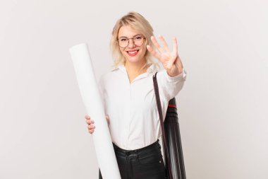 young pretty woman smiling and looking friendly, showing number four. architect concept
