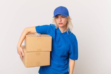 young pretty woman feeling sad, upset or angry and looking to the side. package delivering concept