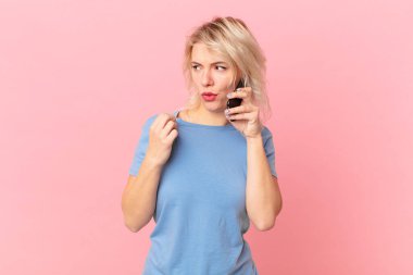 young pretty woman feeling stressed, anxious, tired and frustrated. cell concept