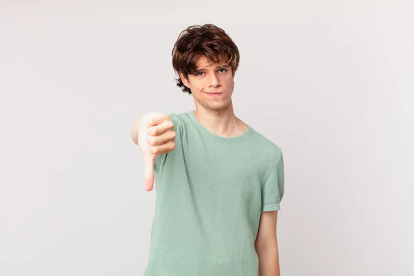 Młody Przystojny Mężczyzna Uczucie Krzyż Pokazując Kciuki Dół — Zdjęcie stockowe