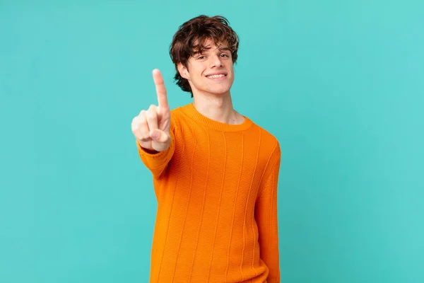 Young Handsome Man Smiling Proudly Confidently Making Number One — Stock Photo, Image