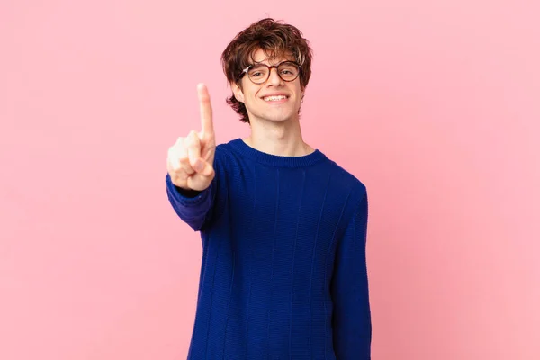 Young Handsome Man Smiling Proudly Confidently Making Number One — Stock Photo, Image