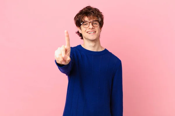 Young Handsome Man Smiling Looking Friendly Showing Number One — Stock Photo, Image