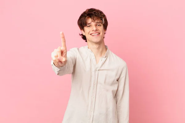 Young Handsome Man Smiling Looking Friendly Showing Number One — Stock Photo, Image