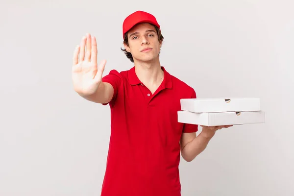 Pizza Deliver Man Looking Serious Showing Open Palm Making Stop — Stockfoto