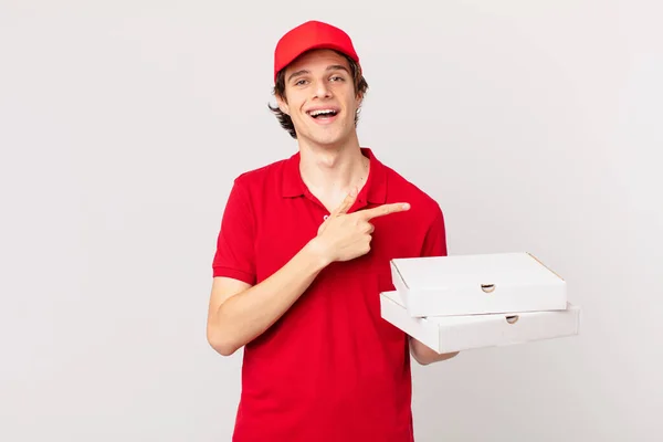Pizza Deliver Man Looking Excited Surprised Pointing Side — Stockfoto