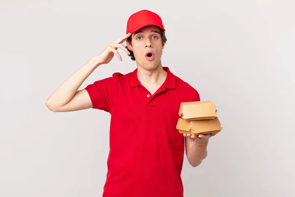 Burger Deliver Man Looking Happy Astonished Surprised — Stok fotoğraf