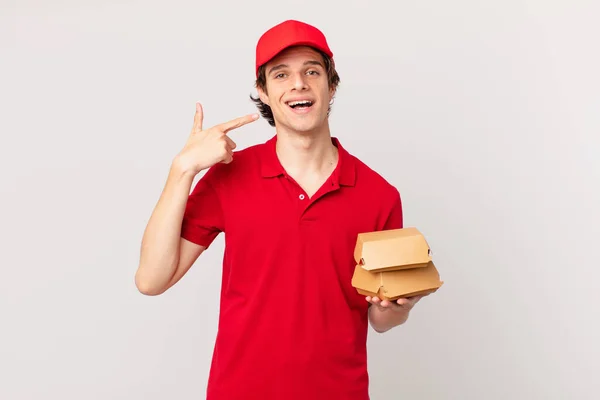 Burger Deliver Man Smiling Confidently Pointing Own Broad Smile — Stock Photo, Image