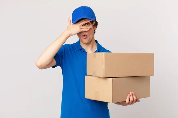 Package Deliver Man Looking Shocked Scared Terrified Covering Face Hand — Stock Photo, Image