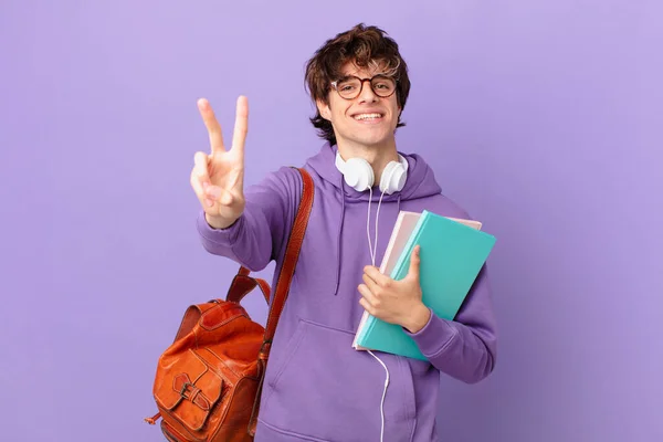 Young Student Man Smiling Looking Happy Gesturing Victory Peace — Zdjęcie stockowe