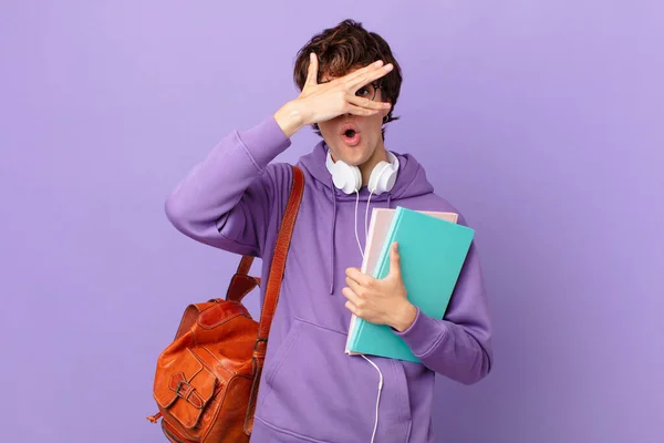 Young Student Man Looking Shocked Scared Terrified Covering Face Hand — Fotografia de Stock