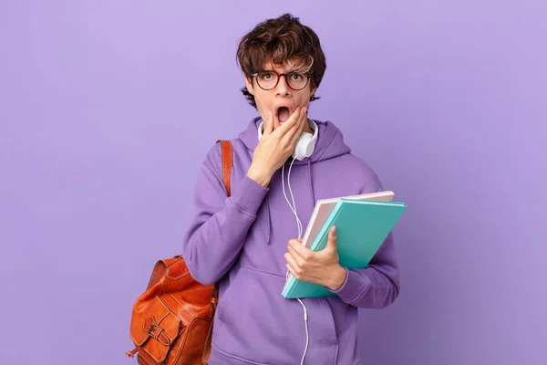Young Student Man Mouth Eyes Wide Open Hand Chin — Stockfoto