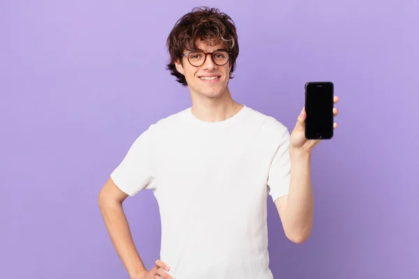 Young Man Smiling Happily Hand Hip Confident Holding Cell — kuvapankkivalokuva