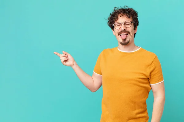 Young Handsome Man Cheerful Rebellious Attitude Joking Sticking Tongue Out — Stock Photo, Image