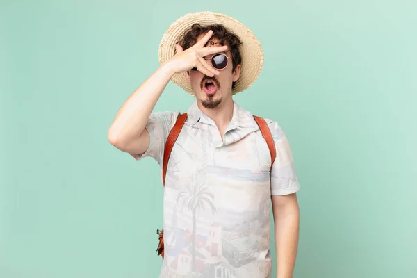 Young Traveller Tourist Looking Shocked Scared Terrified Covering Face Hand — Stockfoto