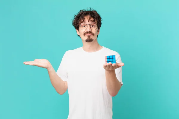 Young Man Solving Intelligence Problem Feeling Puzzled Confused Doubting — Foto de Stock