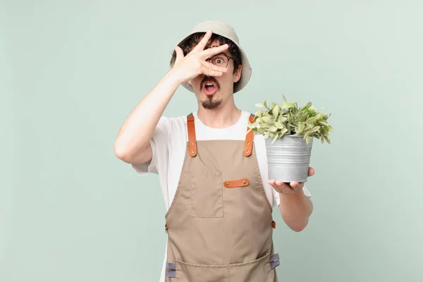 Young Farmer Man Looking Shocked Scared Terrified Covering Face Hand — Stock Photo, Image