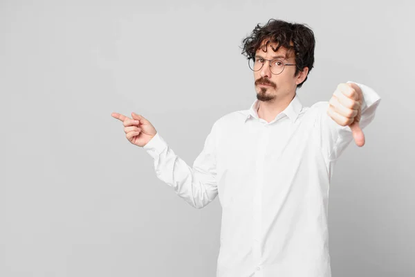 Young Handsome Man Feeling Cross Showing Thumbs — Stock Photo, Image