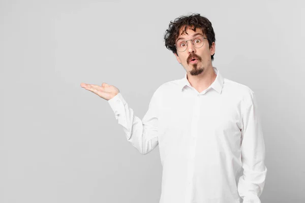 Young Handsome Man Looking Surprised Shocked Jaw Dropped Holding Object — Stock Photo, Image