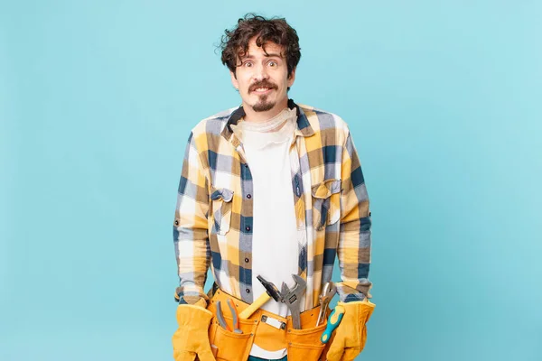 Young Handyman Housekeeper Looking Puzzled Confused — Foto de Stock