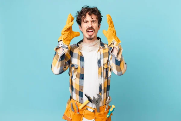 Young Handyman Housekeeper Screaming Hands Air — Foto de Stock