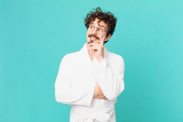 Young Man Wearing Bathrobe Smiling Happily Daydreaming Doubting — Foto de Stock