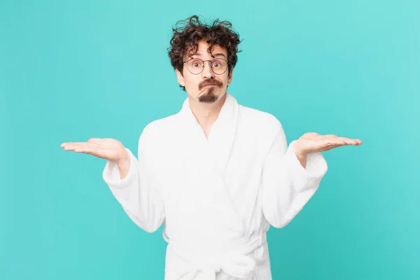 Young Man Wearing Bathrobe Feeling Puzzled Confused Doubting — Stock Photo, Image
