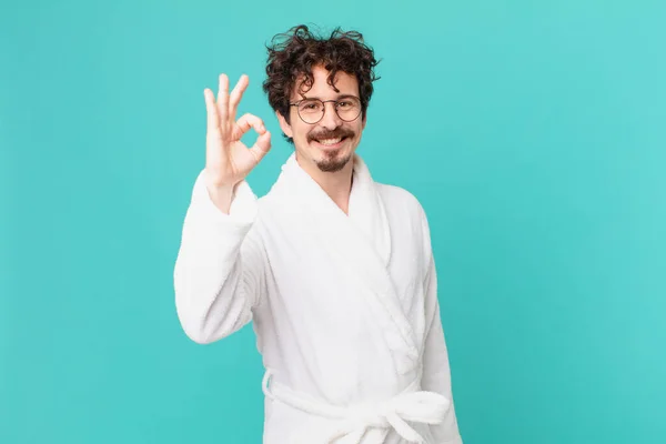 Young Man Wearing Bathrobe Feeling Happy Showing Approval Okay Gesture — Stock Photo, Image