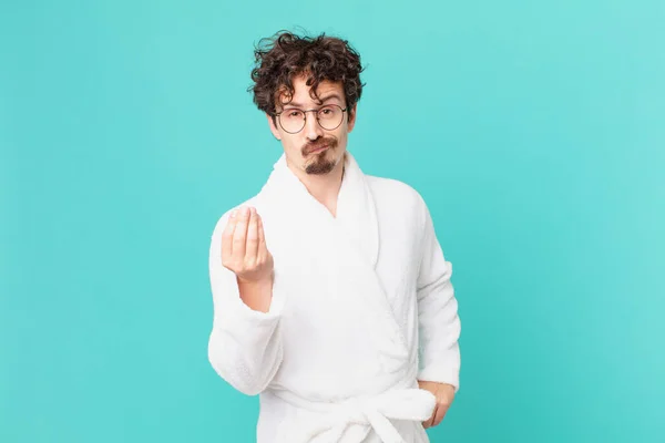 Young Man Wearing Bathrobe Making Capice Money Gesture Telling You — Φωτογραφία Αρχείου