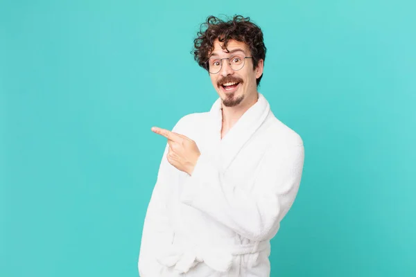 Young Man Wearing Bathrobe Looking Excited Surprised Pointing Side — Stock Photo, Image