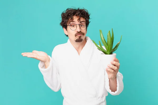 Young Man Wearing Bathrobe Feeling Puzzled Confused Doubting — Stockfoto