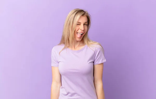 Young Blonde Woman Cheerful Rebellious Attitude Joking Sticking Tongue Out — Stock Photo, Image