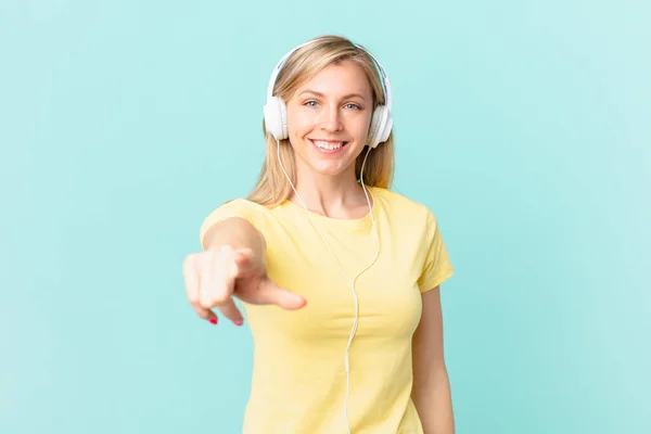 Young Blonde Woman Pointing Camera Choosing You Listening Music —  Fotos de Stock