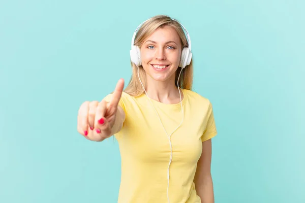 Young Blonde Woman Smiling Proudly Confidently Making Number One Listening — Foto de Stock