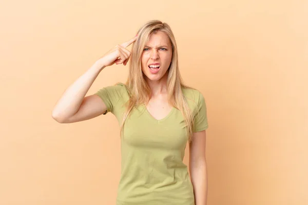 Young Blonde Woman Feeling Confused Puzzled Showing You Insane — Stock Photo, Image