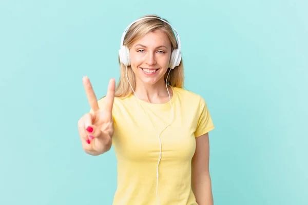 Young Blonde Woman Smiling Looking Happy Gesturing Victory Peace Listening — Stockfoto