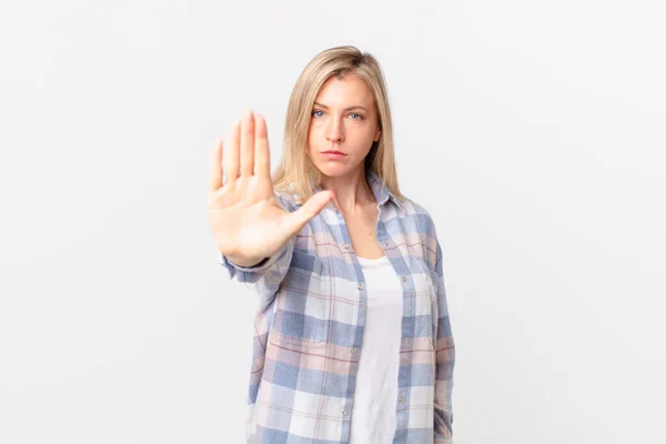 Young Blonde Woman Looking Serious Showing Open Palm Making Stop — Stock Photo, Image