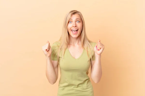 Young Blonde Woman Feeling Shocked Laughing Celebrating Success — Stock Photo, Image