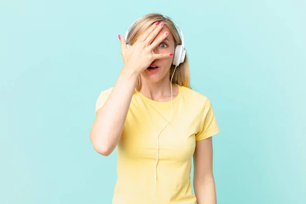 Young Blonde Woman Looking Shocked Scared Terrified Covering Face Hand — Stockfoto