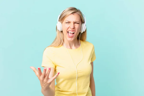 Young Blonde Woman Looking Angry Annoyed Frustrated Listening Music — Stockfoto
