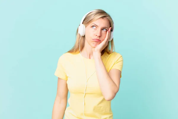 Young Blonde Woman Feeling Bored Frustrated Sleepy Tiresome Listening Music — Stock Photo, Image
