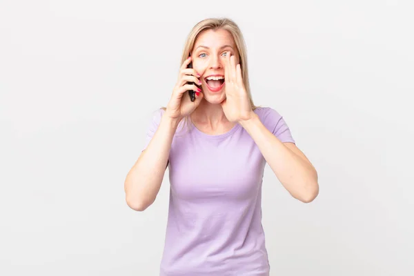 Young Blonde Woman Feeling Happy Giving Big Shout Out Hands — Stock Photo, Image