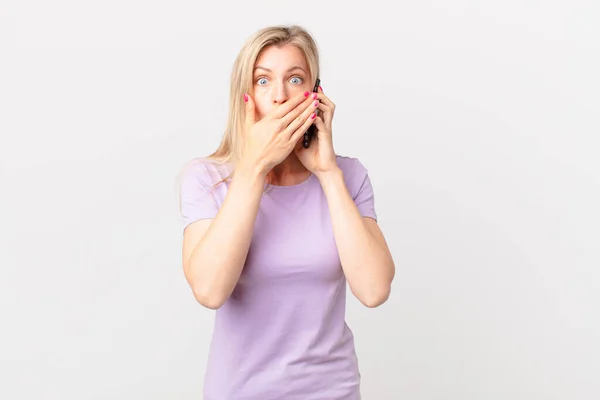 Young Blonde Woman Covering Mouth Hands Shocked Calling Smart Phone — Stock Photo, Image