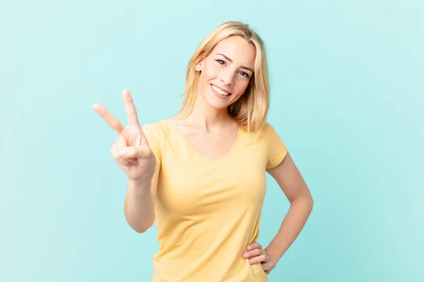 Young Blonde Woman Smiling Looking Friendly Showing Number Two — Stock Photo, Image